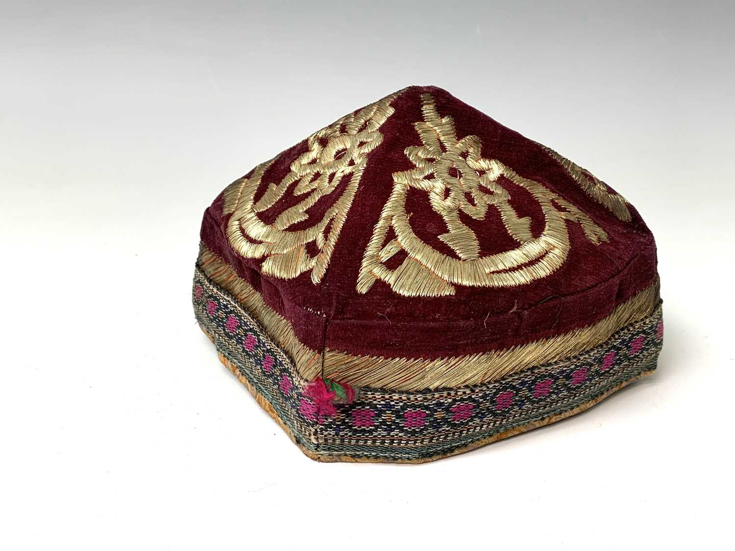 Three eastern skull caps, circa 1920, each embroidered and with gold thread decoration, together a - Image 4 of 13