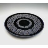 A large amethyst Murano glass charger, with textured geometric decoration, inscribed '... De
