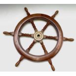 A brass mounted mahogany ship's wheel, mid 20th century, with six turned spokes, diameter 75cm.