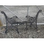 A pair of black painted cast iron bench ends. Height 78cm.