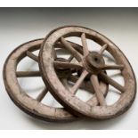 A pair of iron clad small cart or barrow wheels, 19th century, diameter 56cm.