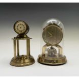 A German Schatz & Sons 1000 day brass torsion clock, numbered 54, under a perspex dome and another