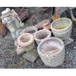 Assorted plant pots and statues.