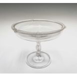 A clear glass tazza, possibly Powell & Sons, Whitefriars, circa 1900, the rim with spiral moulded