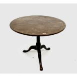 A George III mahogany tripod table, the circular top with bird cage action, height 66cm, diameter