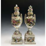 A pair of German porcelain Carl Thieme, Potschappel pedestal vases, covers and stands, late 19th