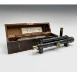 A lacquered brass surveyors level, late 19th century, the mahogany box labelled for J.T.Letcher,