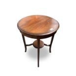 An Edwardian circular inlaid mahogany occasional table, with square section splay legs joined by