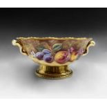 A Royal Worcester fruit painted pedestal fruit bowl, signed E.Clark, with applied twin handles and