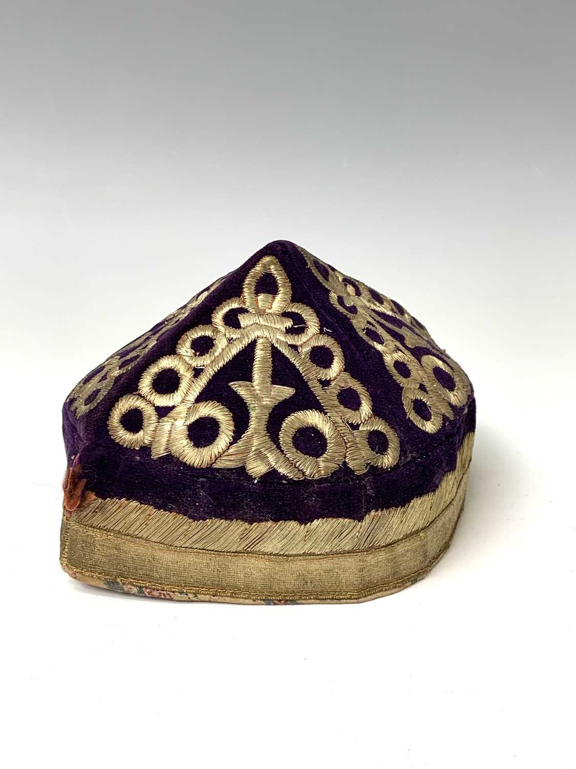Three eastern skull caps, circa 1920, each embroidered and with gold thread decoration, together a - Image 8 of 13