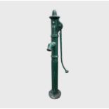 A large green painted cast iron water pump. Height 145cm.