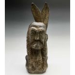 A carved wood bust of a Native American Indian. Height 50cm.