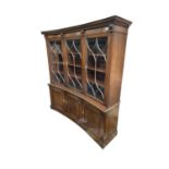 A large Reproduction mahogany library bookcase, height 182cm, width 174cm, depth 44cm.