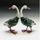 A pair of painted metal geese ornaments. Height 43cm.