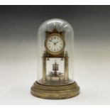 A German brass torsion clock, circa 1900, the circular white enamel dial with Arabic numerals and