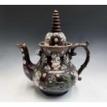 A Measham treacle glazed barge ware teapot, dated 1876, of large proportions, the domed cover