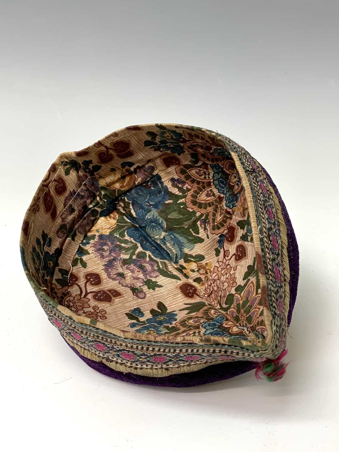 Three eastern skull caps, circa 1920, each embroidered and with gold thread decoration, together a - Image 5 of 13