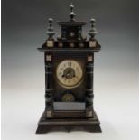 An American eight-day mantel clock, with stained pine case, striking on a coiled gong, height 56cm.