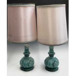 A pair of mid-century pottery and silvered table lamp bases, with shades. Overall height 89cm.