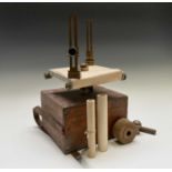 A surveyor's brass mounted plane table instrument, fitted a simple alidade with rolling paper