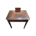 An early 19th century mahogany side table, in the manner of Gillows, the reeded top with a hinged