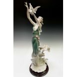 A Guiseppe Armani Florence figure, 'White Wings', modelled as a windswept lady surrounded by