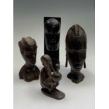 Four African carved wood figures. Tallest 23cm.