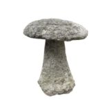 A granite staddle stone with circular top and tapered base. Height 65cm.