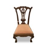 A Chippendale style mahogany dining chair, 20th century, with husk carved decoration and cabriole