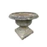 A reconstituted stone urn. Height 45cm.