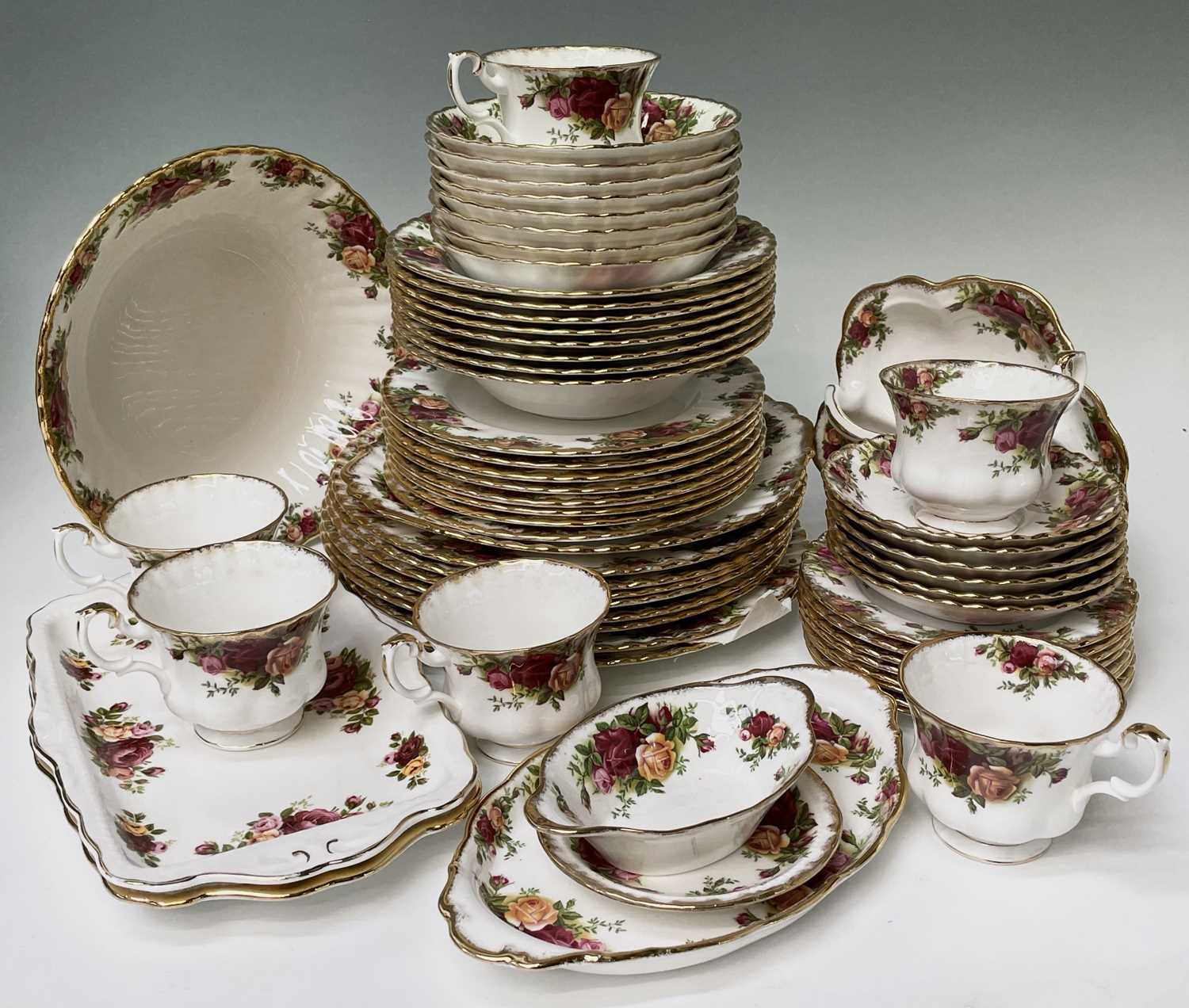 An extensive Royal Albert 'Old Country Roses' dinner and tea service comprising nine dinner