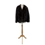 A dark mink jacket, silk lined, deep collar, two pockets, hook fastenings and two decorative dummy