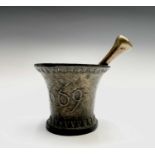 A 17th century bronze pestle and mortar, inscribed WFI and dated 1669, mortar height 12.5cm,