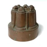 A Victorian copper jelly mould, by Benham & Froud, height 12cm, diameter 12.5cm. Provenance: