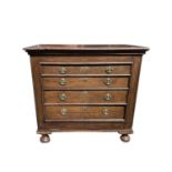 A Continental oak chest of drawers, early 18th century, with four long drawers each with replacement