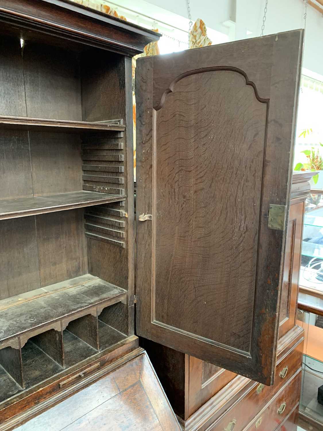 A George III oak bureau bookcase, with a pair of arched panelled doors opening to reveal shelves and - Image 4 of 6