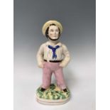 A Victorian Staffordshire figure of a sailor, height 33.5cm. Provenance:Michael Trethewey. A