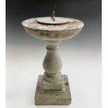 A metal-mounted garden sundial on a reconstituted stone column base. Height 62cm.Condition report: