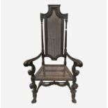 A William & Mary carved walnut armchair, circa 1690, with rattan back and seat, open arms, on scroll