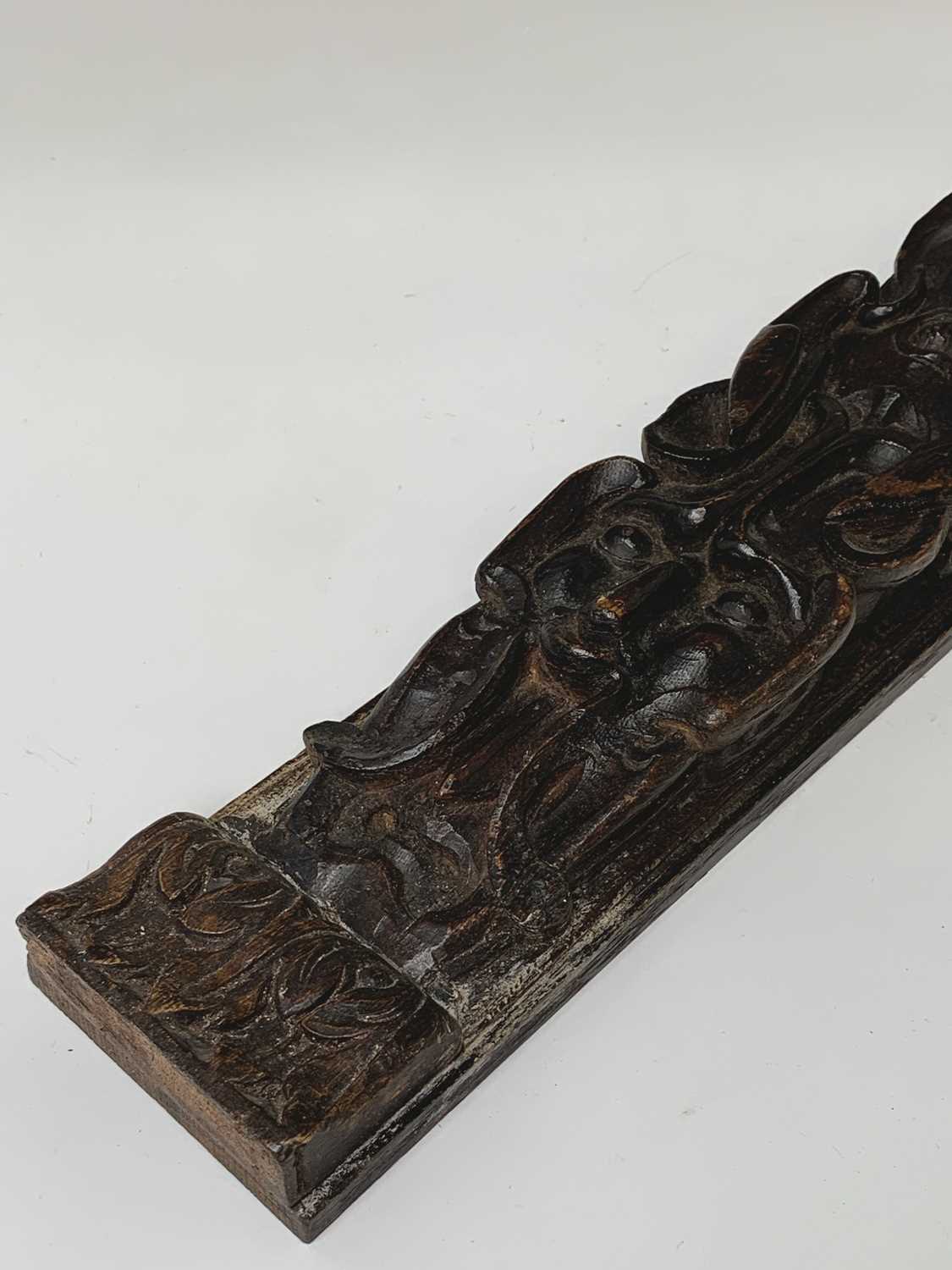An oak carved oak term panel, 16th century, depicting a male figure rising above a vacant - Image 5 of 10