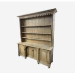 A Cornish pine kitchen dresser, 19th century, of large proportions, with moulded and arcaded frieze,