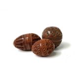 Three 19th Century carved coquilla nut pomanders, largest length 6cm. Provenance:Michael