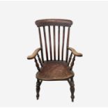 A Victorian beech and elm lathe back armchair, height 112.5cm, width 59.5cm.