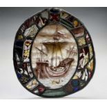 A Victorian lead lined stained glass oval panel, depicting a galleon to the centre, 40 x 36.5cm.