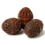 Three 19th Century carved coquilla nut pomanders, largest length 6.5cm. Provenance:Michael