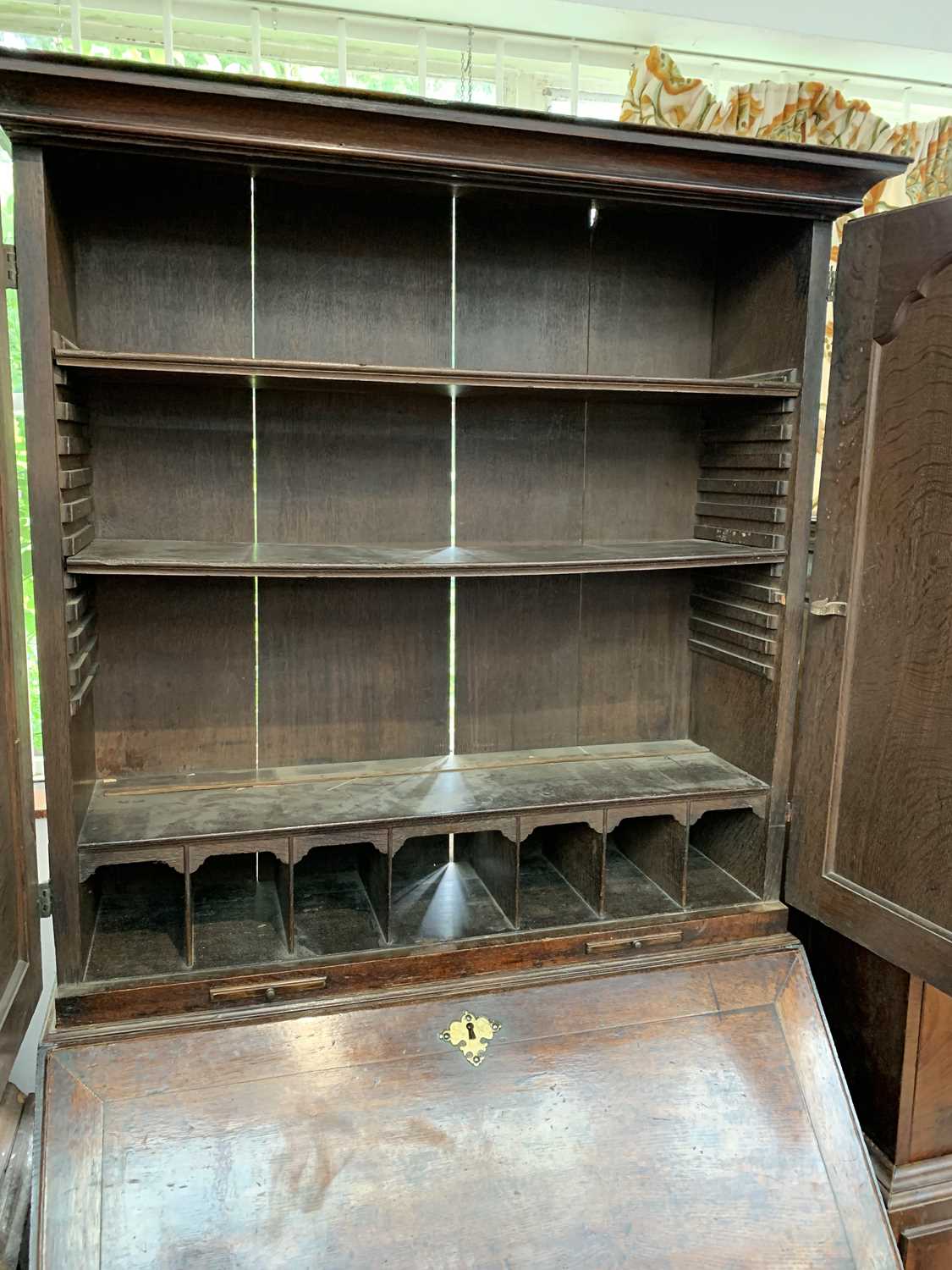 A George III oak bureau bookcase, with a pair of arched panelled doors opening to reveal shelves and - Image 5 of 6