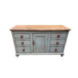 A Victorian painted pine low dresser, with a central panelled door flanked by six drawers, height
