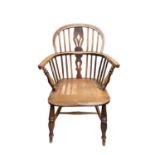 An ash and elm Windsor armchair, circa 1860, with hoop back and pierced vase splat on turned front