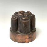 A Victorian copper jelly mould, height 10cm, diameter 11.5cm. Provenance:Michael Trethewey. A