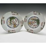 A pair of English delft polychrome plates, mid 18th century, probably Liverpool, each painted with